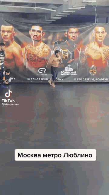 a man stands in front of a banner that says ufc