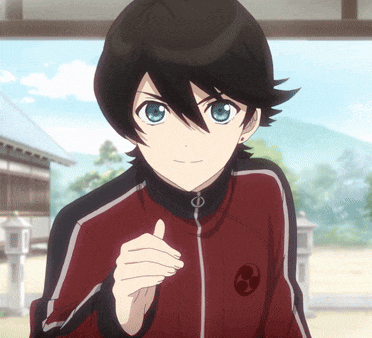 a young boy with black hair and blue eyes is wearing a red and black jacket