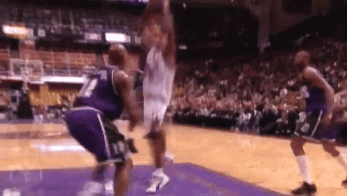 a basketball player with the number 10 on his shorts jumps in the air