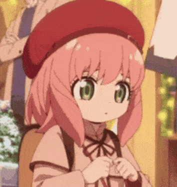 a girl with pink hair and green eyes is wearing a red hat and a backpack .