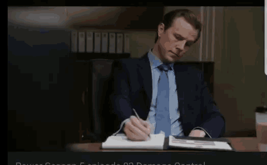 a person writing on a piece of paper that says ok bit