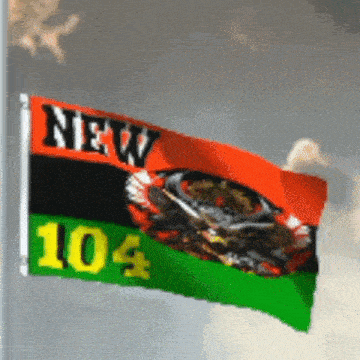 a flag with the number 104 on it is waving in the wind