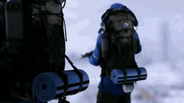 a person carrying a backpack with a diamond on it