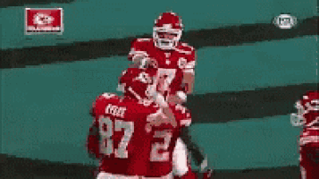 a football player wearing a red jersey with the number 87 on it