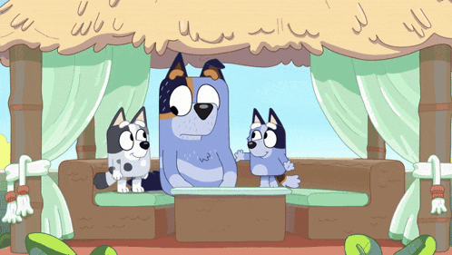 two cartoon dogs are sitting on a couch under a roof