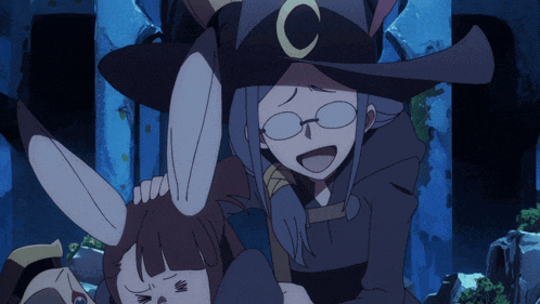 a witch with a crescent moon on her hat is holding another witch