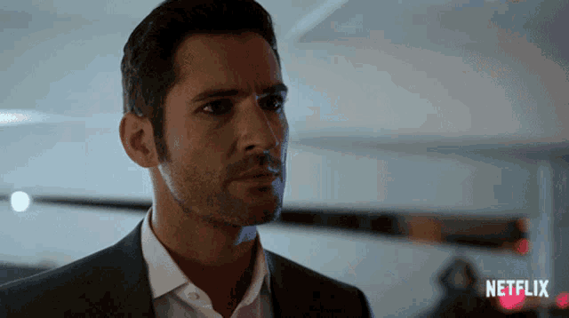 a close up of a man 's face with a netflix logo in the background