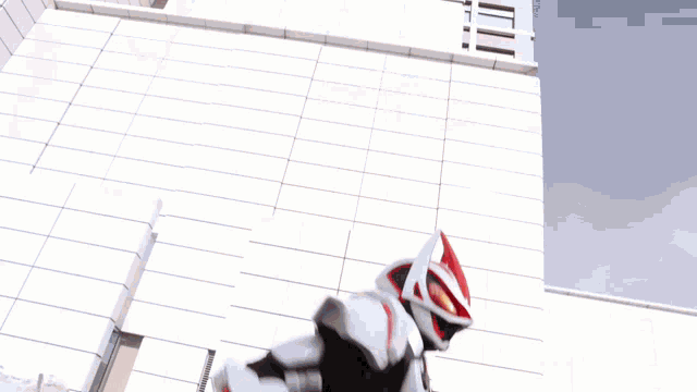 a person in a superhero costume with a belt that says ' samurai ' on it