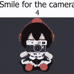 a stuffed animal with headphones and a camera on its face .