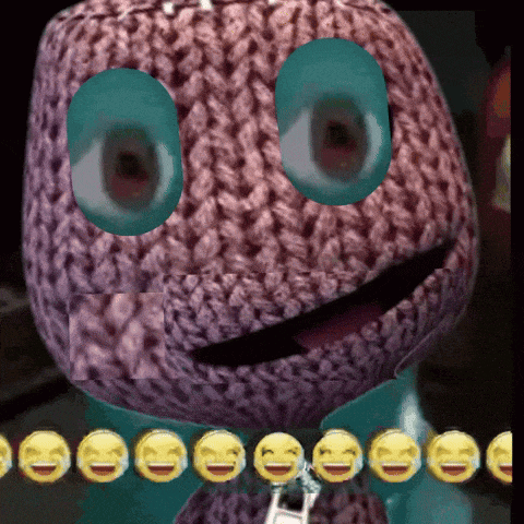 a close up of a stuffed animal with smiley faces on it 's face