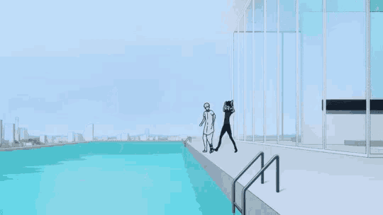 a man is jumping into a swimming pool while another man is standing in the water .