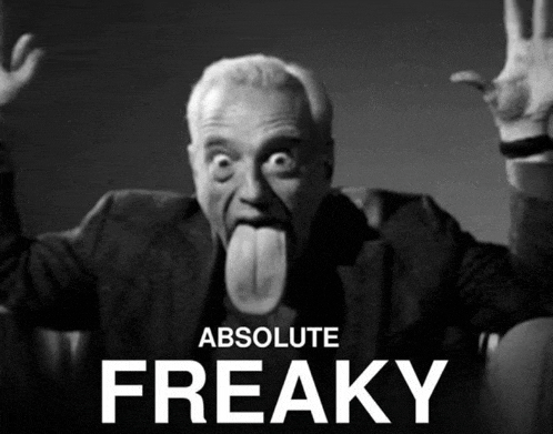 a black and white photo of a man sticking his tongue out with the words absolute freaky below him