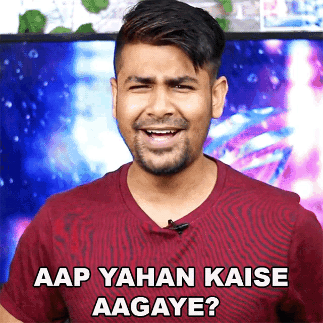 a man in a maroon shirt says " aap yahan kaise aagaye "