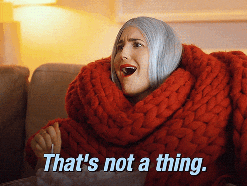 a woman is wrapped in a red scarf and says that 's not a thing