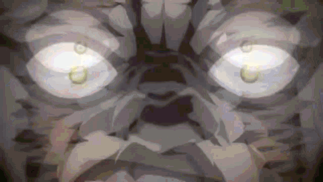 a close up of a person 's face with their eyes glowing