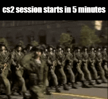 a group of soldiers marching down a street in a parade .