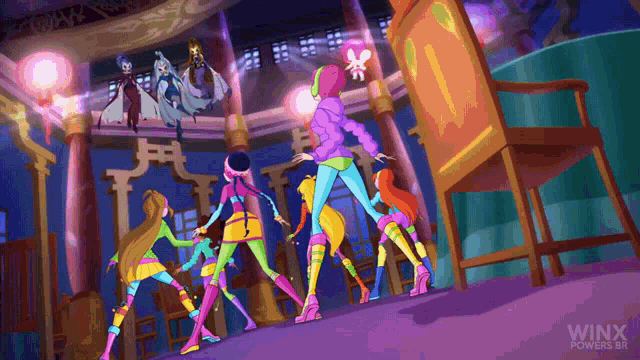 a group of girls are dancing in a room with the words winx powers on the bottom right