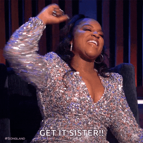 a woman in a sequined dress is laughing and saying get it sister .