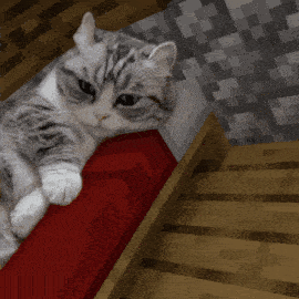 a cat is laying on top of a red brick