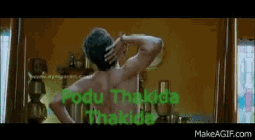 a shirtless man is standing in front of a mirror in a room with his hand on his head .