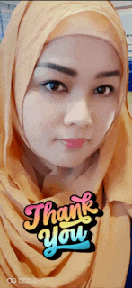 a woman wearing a hijab with a thank you sticker on it