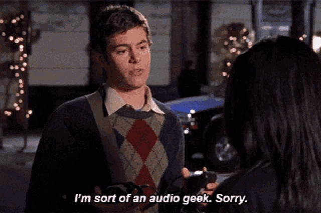 a man in an argyle sweater says i 'm sort of an audio geek