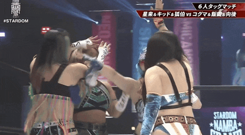 a female wrestling match is being shown on a screen that says #stardom