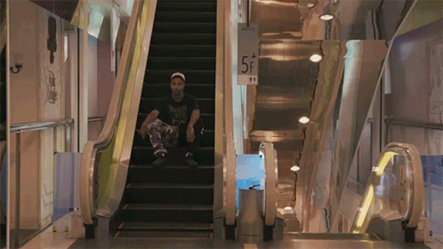Going Down Escalator GIF - Going Down Escalator Sitting On Steps GIFs