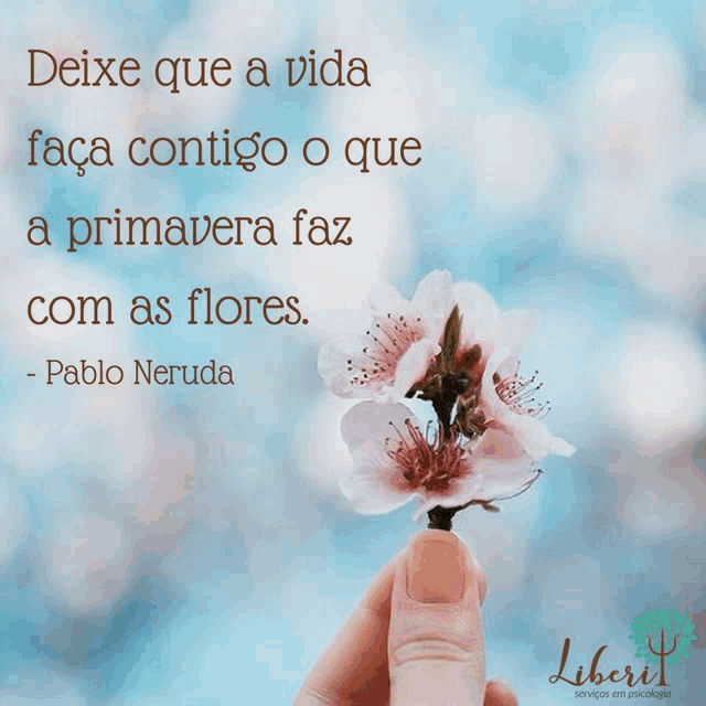 a person holding a flower with a quote from pablo neruda on it