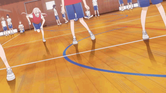 a person wearing a pair of white adidas shoes is running on a wooden floor