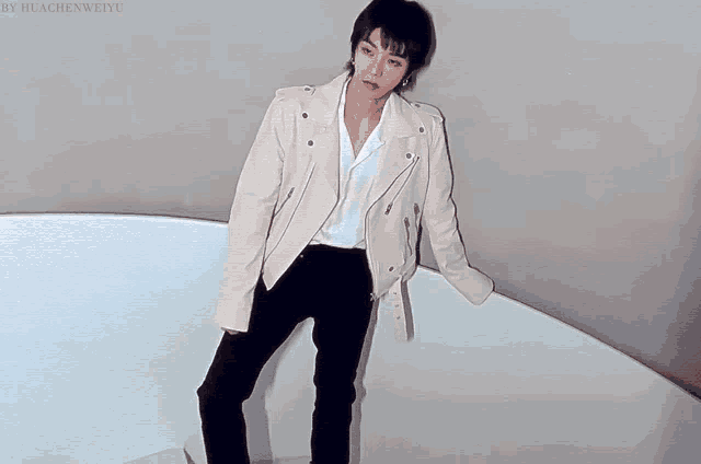 a woman wearing a white jacket and black pants is standing next to a white rectangle that says by huachenweiyu