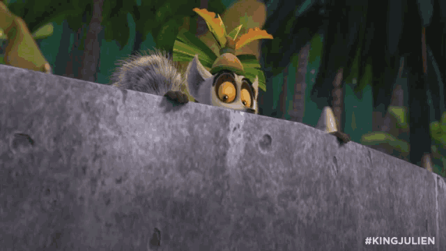 a cartoon king julien is peeking over a ledge