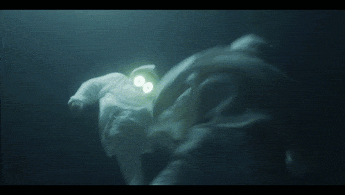 a person in a white hoodie with glowing eyes is kneeling down