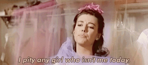 a woman is wearing a pink tiara and saying `` i pity any girl who isn 't me today '' .