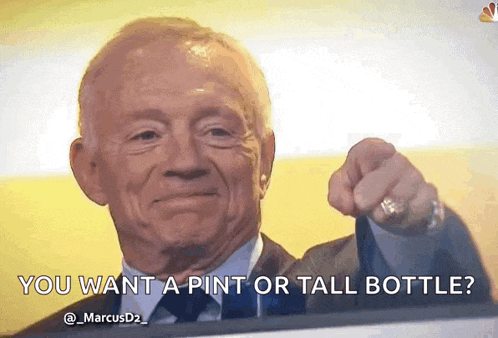 a man in a suit and tie is pointing at the camera and saying " you want a pint or tall bottle " .