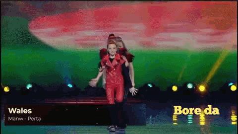 wales is the name of the song being performed on the stage