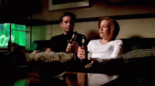 Mulder And Scully Beer GIF - Mulder And Scully Beer Popcorn GIFs