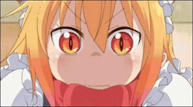 a close up of a cartoon character 's face with red eyes