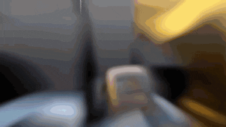 a blurred image of a person 's feet with the letter c in the corner