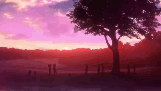 a group of people are standing under a tree in a park at sunset