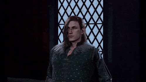 a man with long hair and elf ears is smiling