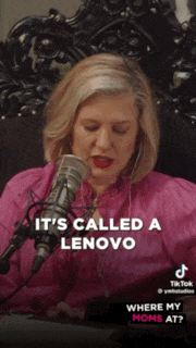 a woman in a pink shirt is talking into a microphone with the words it 's called a lenovo