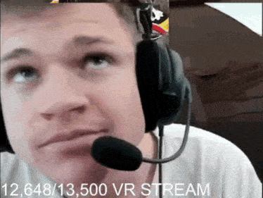 a man wearing headphones and a microphone with the words 12,648/13,500 vr stream below him
