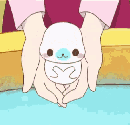 a person is holding a stuffed animal in their hands with the letter s2 on it