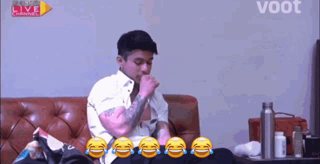 a man is sitting on a couch with a live channel advertisement