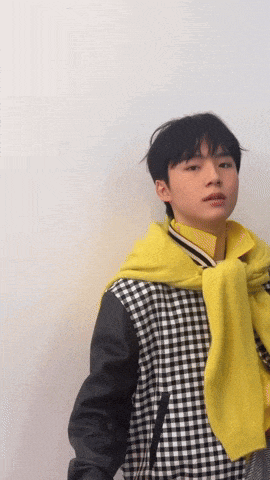 a man wearing a yellow scarf around his neck