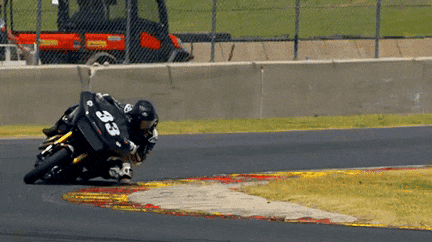 a person on a motorcycle with the number 33 on their back