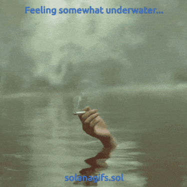 a hand holding a cigarette in the water with the words feeling somewhat underwater below it