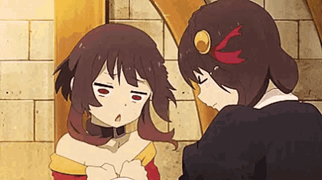 a couple of anime girls are standing next to each other .