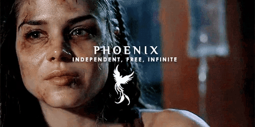 a close up of a woman 's face with the words phoenix independent free infinite behind her